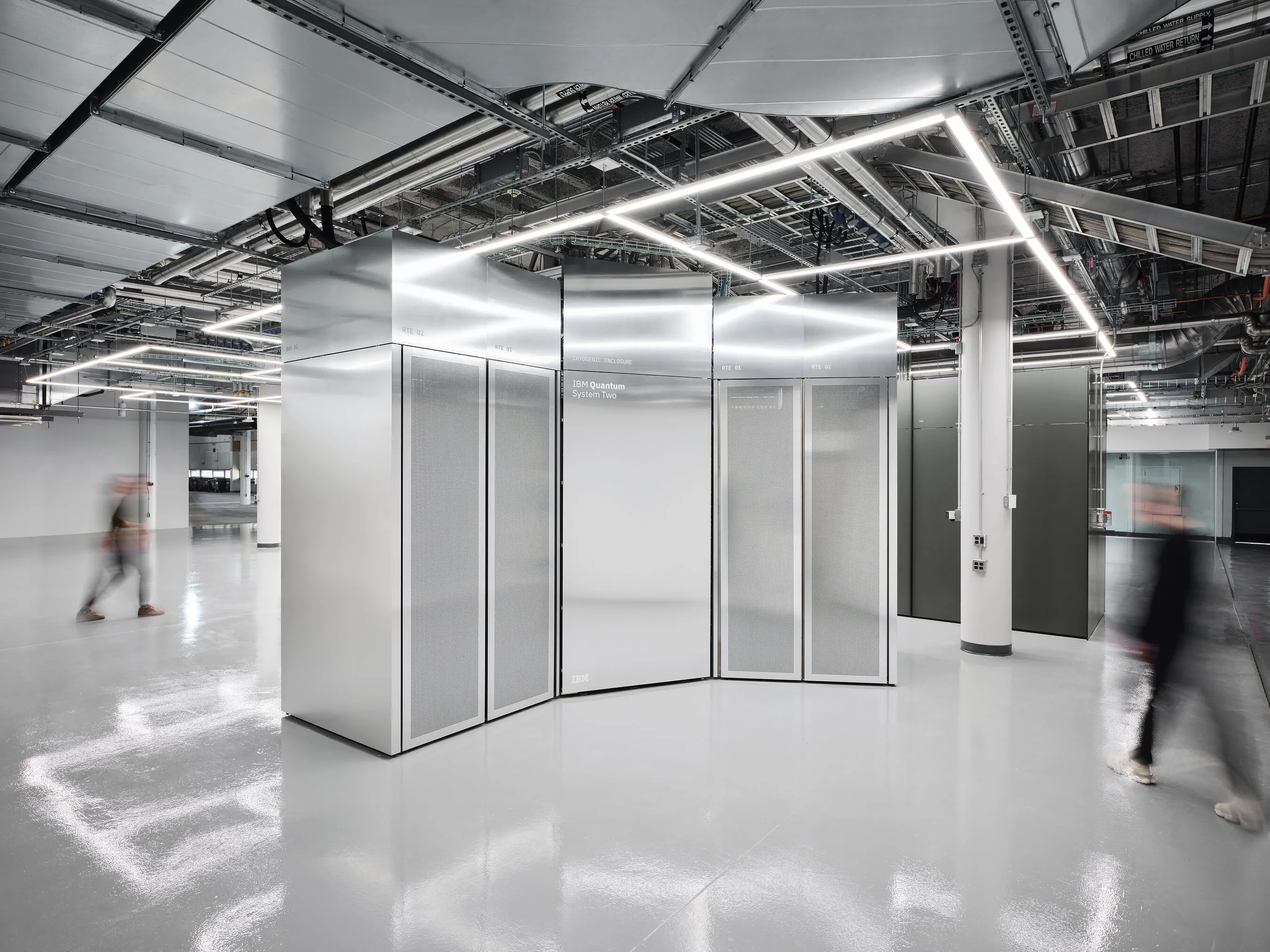 IBM Quantum System Two computer in a bright industrial data centre.