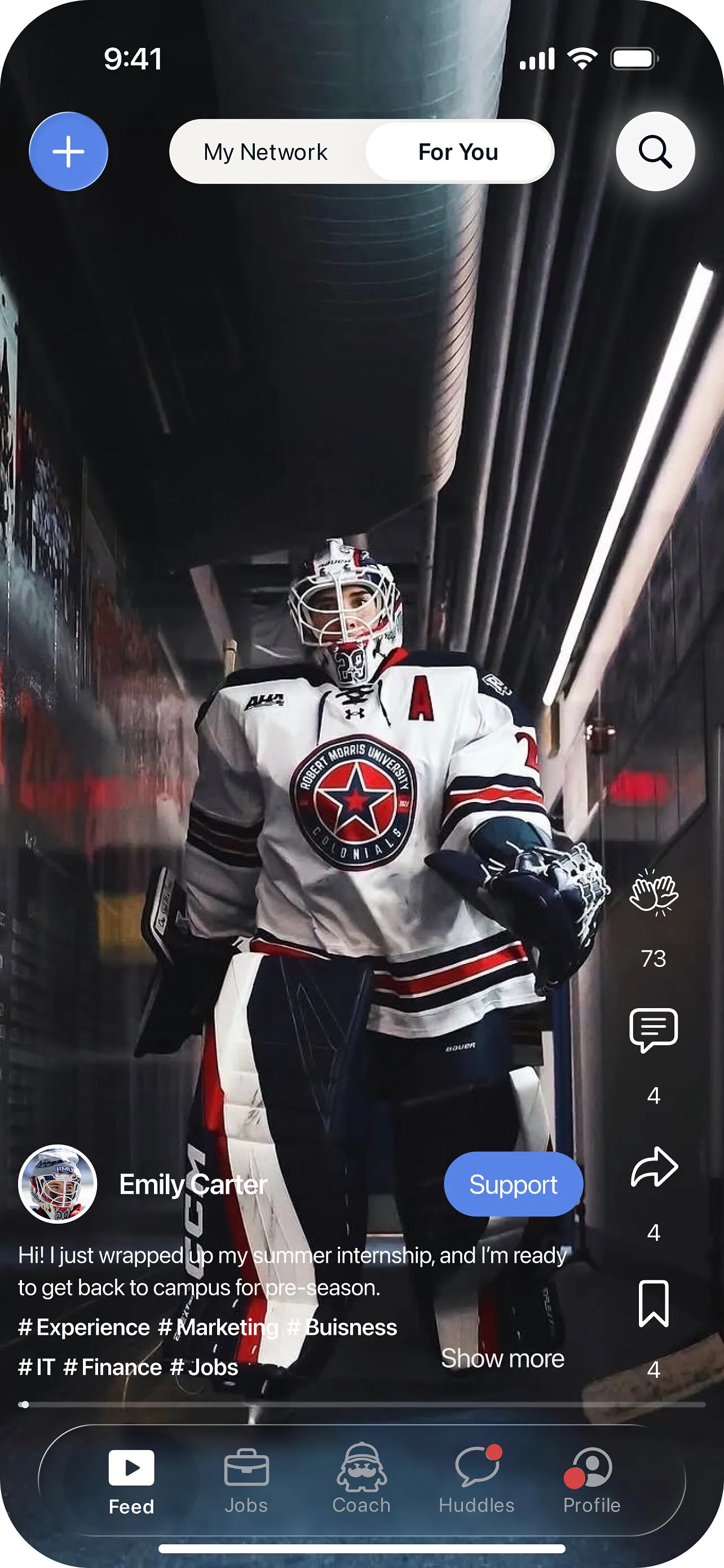 A hockey goalie in a Robert Morris University jersey walking through a tunnel