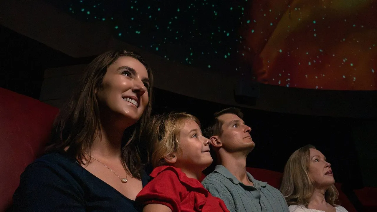 Visitors watch a star projection inside the restored planetarium.
