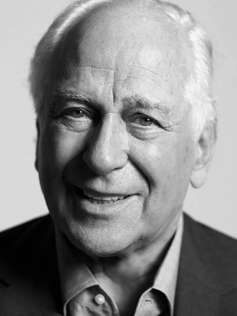 Sir Evelyn de Rothschild smiling in a suit.